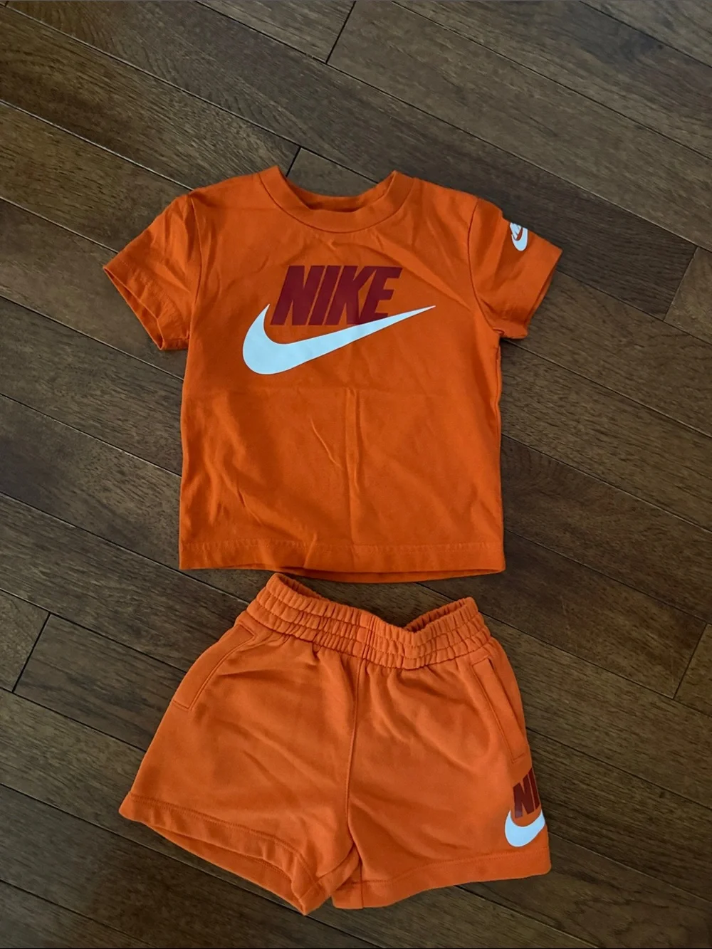 Nike Orange Kids Two-Piece Tee & Shorts Set with White Swoosh